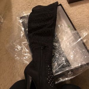 Bebe suede boots with cut out on the leg. Brand new in box fits shoe size 5.5